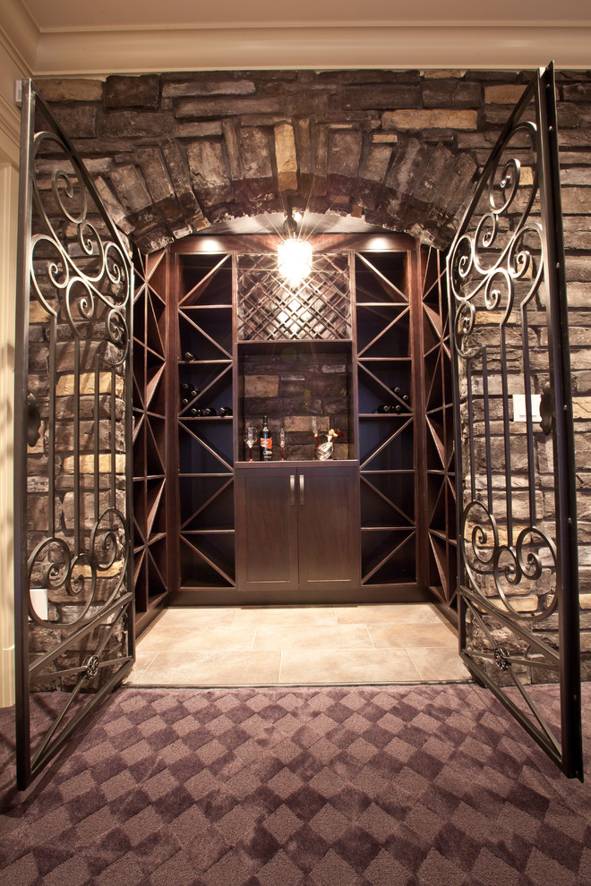 Inspiration for a small mediterranean slate floor wine cellar remodel in Vancouver with display racks