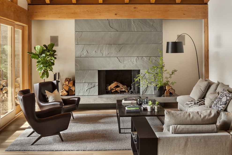 This is an example of a country living room in Vancouver with a standard fireplace.
