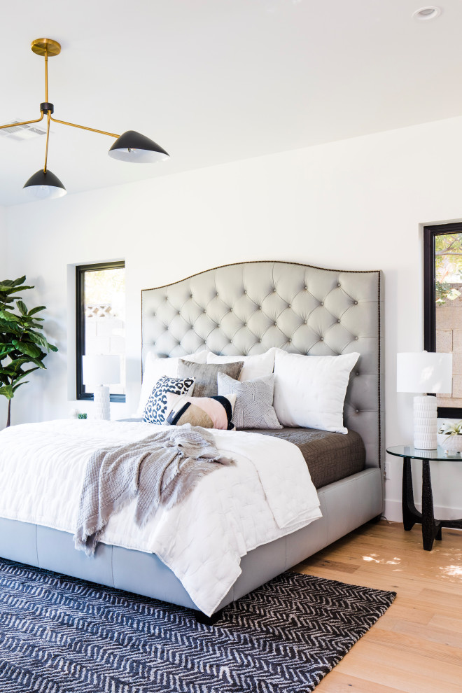 Bedroom - mid-sized transitional master medium tone wood floor bedroom idea in Phoenix with white walls
