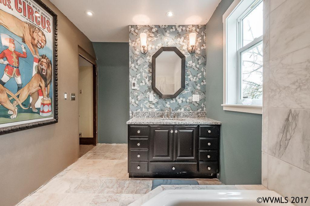 This is an example of a large traditional master bathroom in Other with furniture-like cabinets, black cabinets, an alcove tub, a shower/bathtub combo, a one-piece toilet, blue tile, marble, blue walls, marble floors, an integrated sink, granite benchtops, multi-coloured floor, an open shower and multi-coloured benchtops.