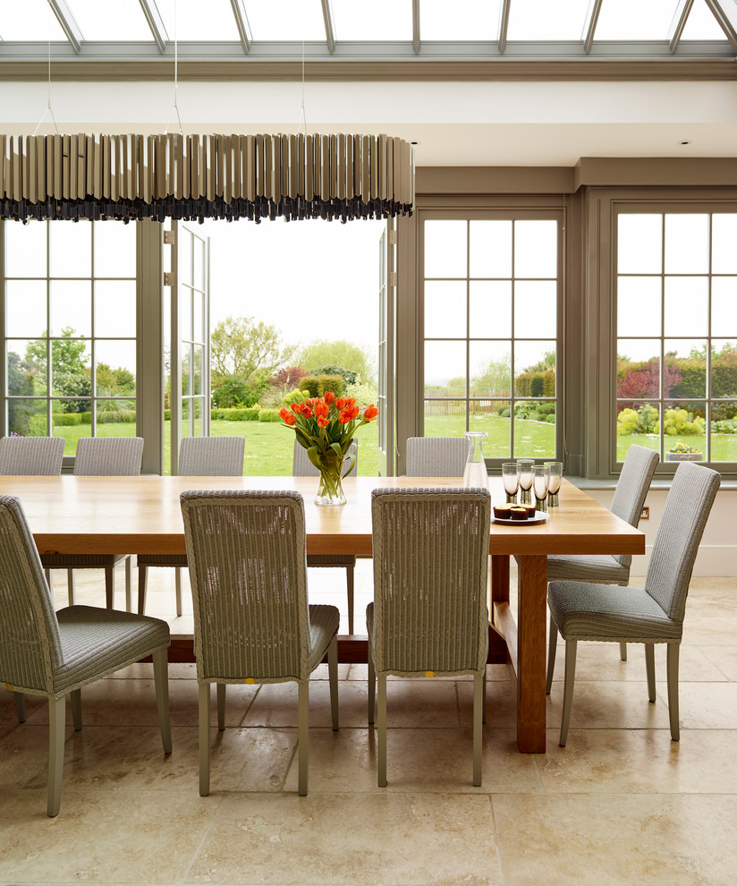 This is an example of an expansive classic open plan dining room in Essex.
