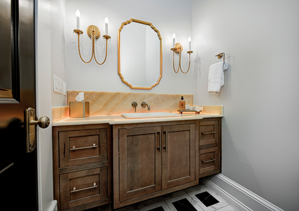Powder room - mid-sized contemporary white floor powder room idea in Indianapolis with shaker cabinets, medium tone wood cabinets, gray walls, an undermount sink, granite countertops, white countertops and a built-in vanity