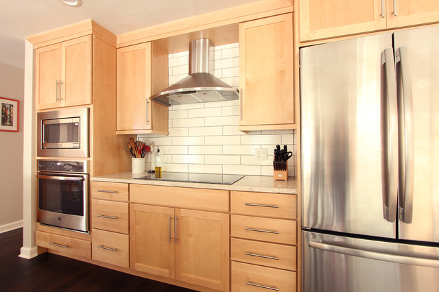 Natural Maple Cabinets In Open Kitchen With Quartz Countertops