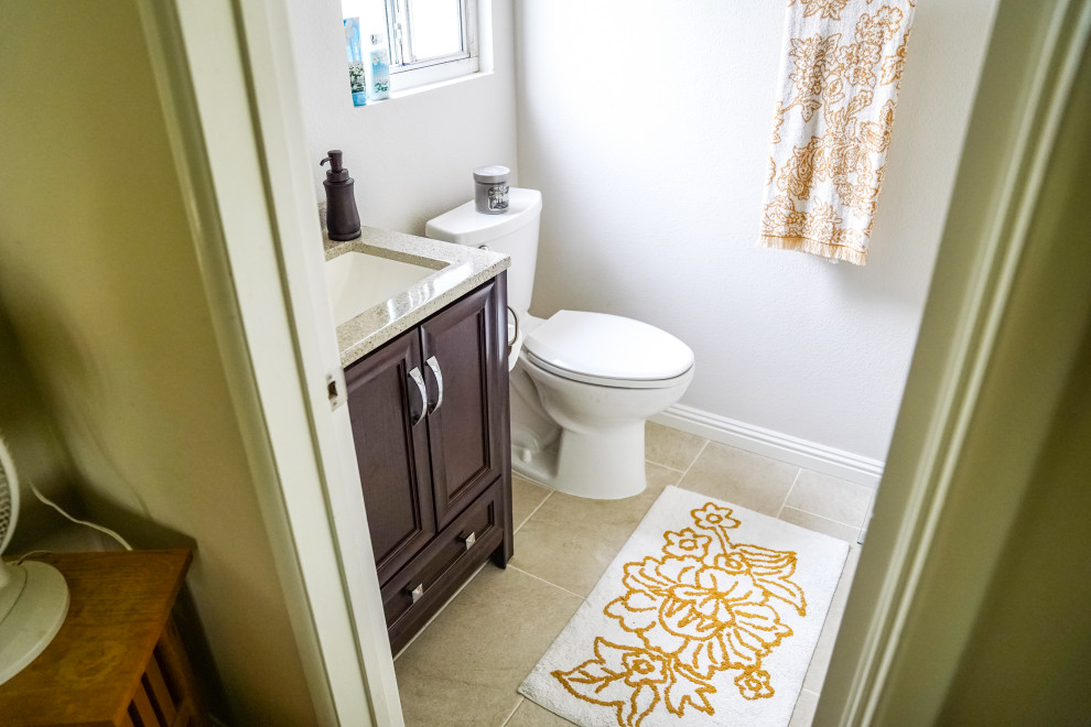 Inspiration for a small contemporary kids bathroom in Orange County with granite benchtops, a single vanity, a built-in vanity, a one-piece toilet, grey walls, cement tiles, a drop-in sink, green floor, brown benchtops and an enclosed toilet.