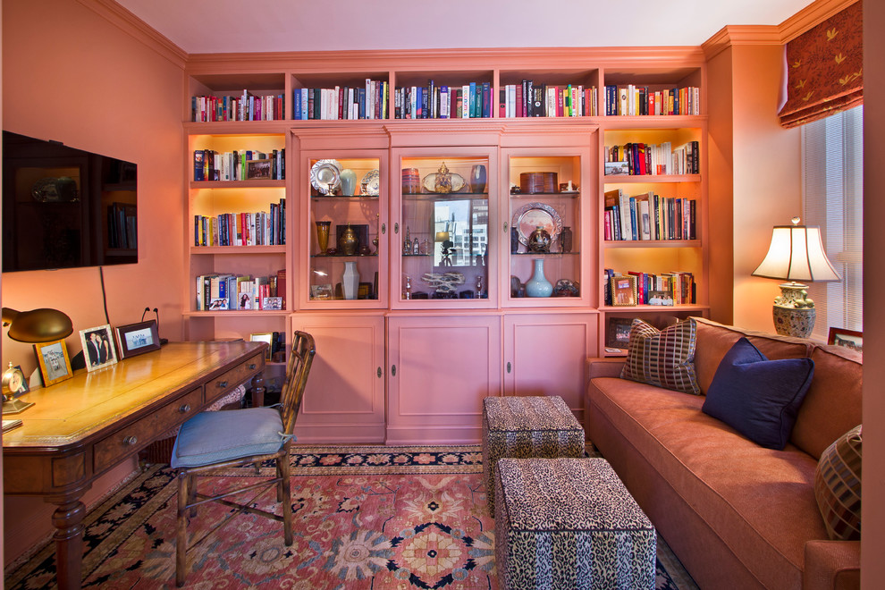 Design ideas for a mid-sized traditional enclosed family room in New York with pink walls and a wall-mounted tv.