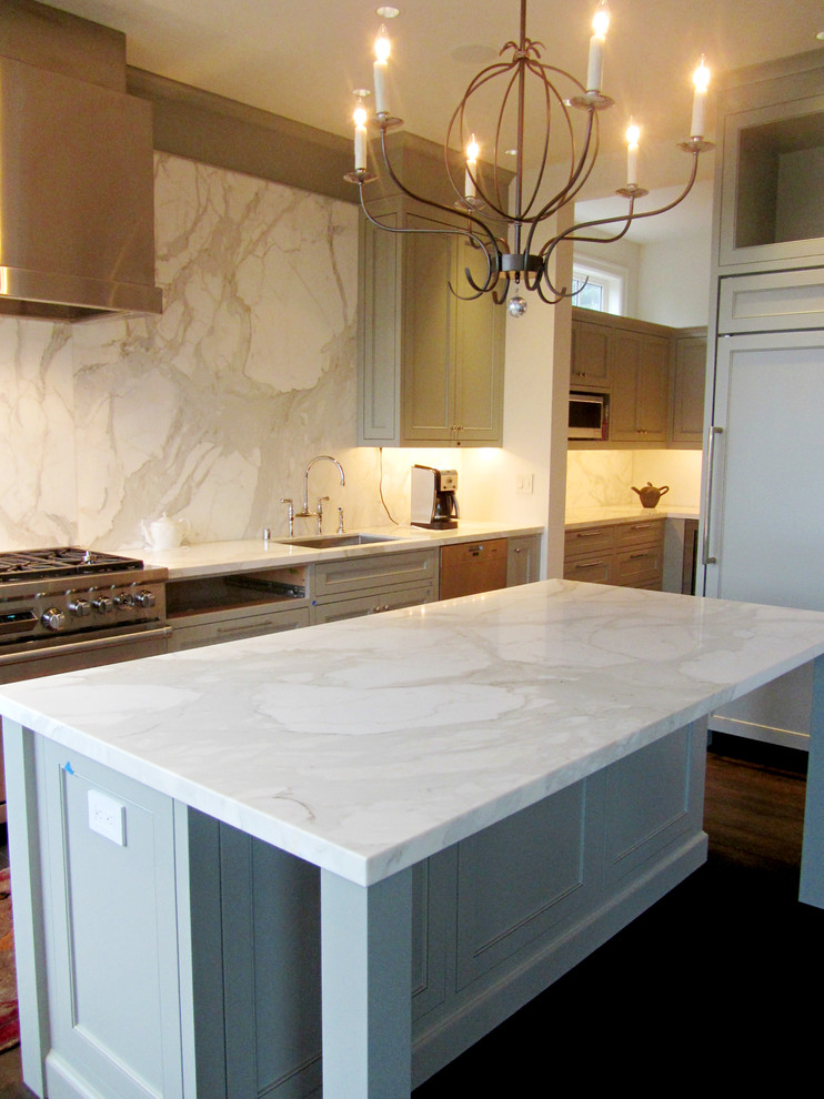 L-shaped eat-in kitchen photo in Seattle with an undermount sink, raised-panel cabinets, blue cabinets, marble countertops, white backsplash, stone slab backsplash and stainless steel appliances