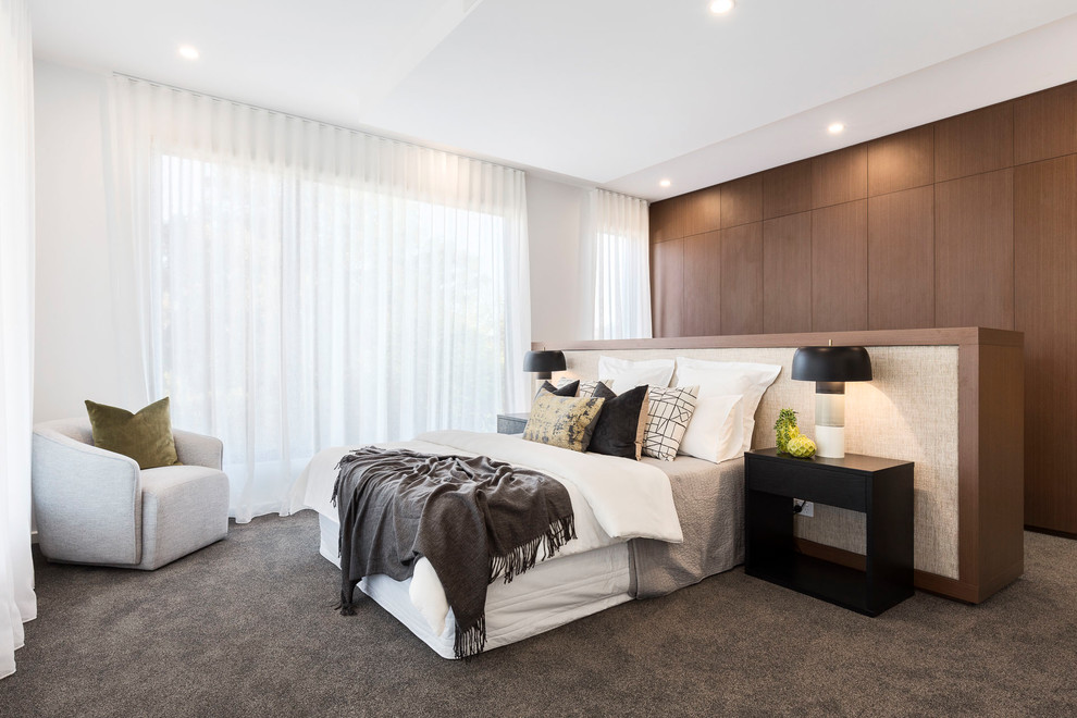 Contemporary master bedroom in Melbourne with white walls, carpet, no fireplace and grey floor.