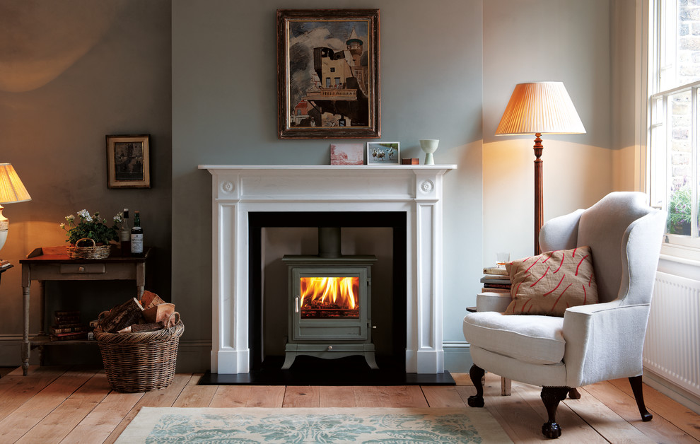 Inspiration for a country living room in Other with a wood burning stove, no tv and feature lighting.