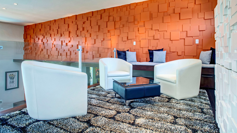 Inspiration for a contemporary loft-style family room remodel in Orange County with orange walls