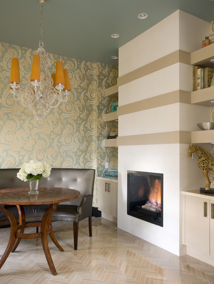 Design ideas for a contemporary dining room in Denver with a standard fireplace.