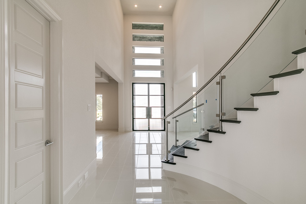 Inspiration for a hallway in Houston with white walls, ceramic floors and white floor.