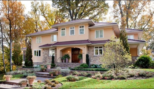 Inspiration for a large mediterranean two-storey beige house exterior in Philadelphia with mixed siding and a shingle roof.