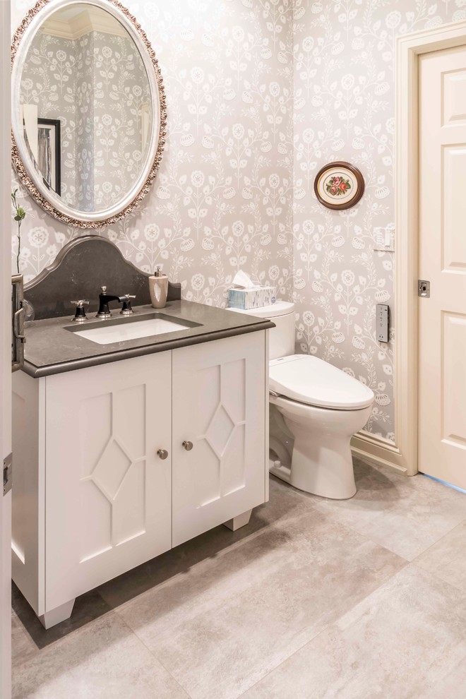 Bathroom - mid-sized transitional u-shaped and 3/4 medium tone wood floor and brown floor bathroom idea in Calgary with an undermount sink, white cabinets, marble countertops, gray backsplash, ceramic backsplash, paneled appliances, an island and furniture-like cabinets