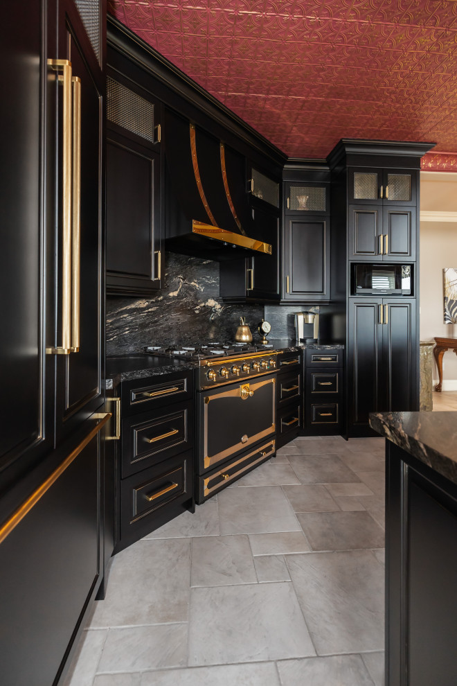 Example of a large eclectic kitchen design with raised-panel cabinets, black cabinets, granite countertops, black backsplash, granite backsplash, paneled appliances, an island and black countertops