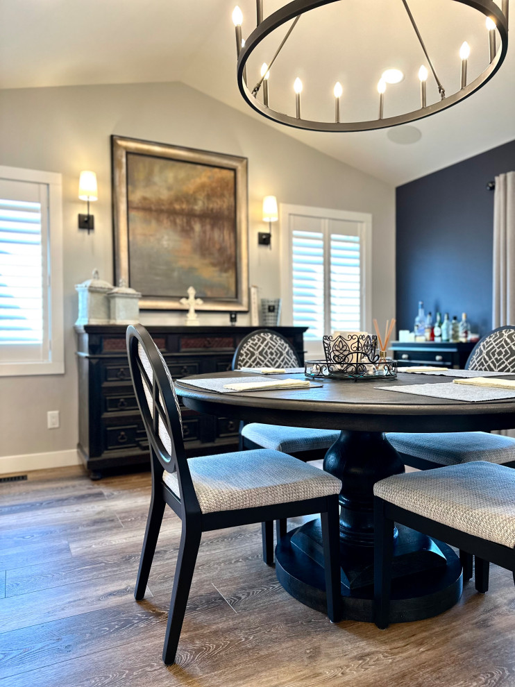 Kitchen/dining room combo - mid-sized transitional medium tone wood floor, brown floor and vaulted ceiling kitchen/dining room combo idea with white walls
