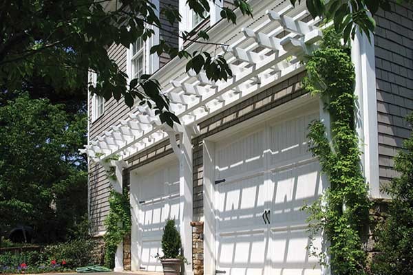 This is an example of a mid-sized traditional attached two-car garage in Atlanta.