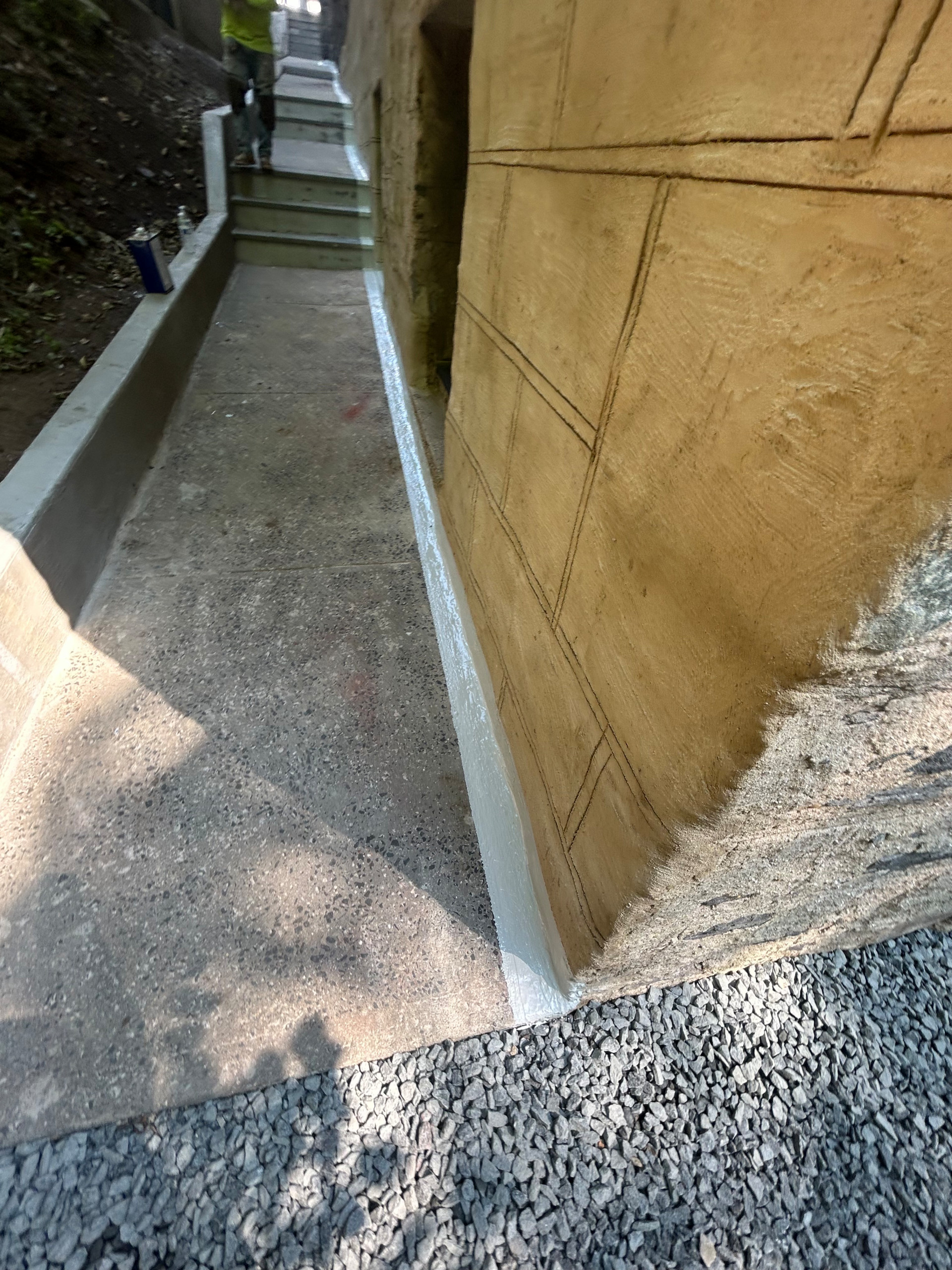 Curb/Exterior Wall Stucco/ParaPro Flashing/Garage slab replacement/Drainage