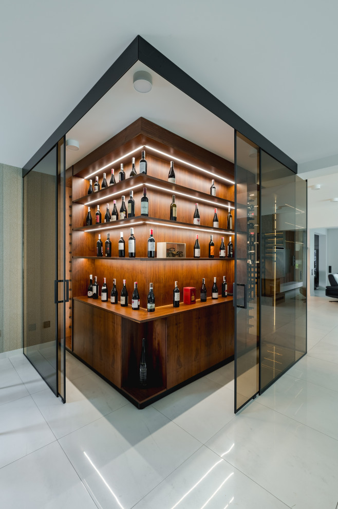 Photo of a contemporary wine cellar in Other with feature lighting.