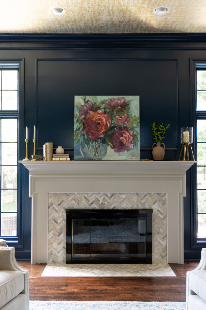 Design ideas for a transitional formal enclosed living room in Kansas City with blue walls, dark hardwood floors, a standard fireplace, a tile fireplace surround, no tv, brown floor, wallpaper and decorative wall panelling.