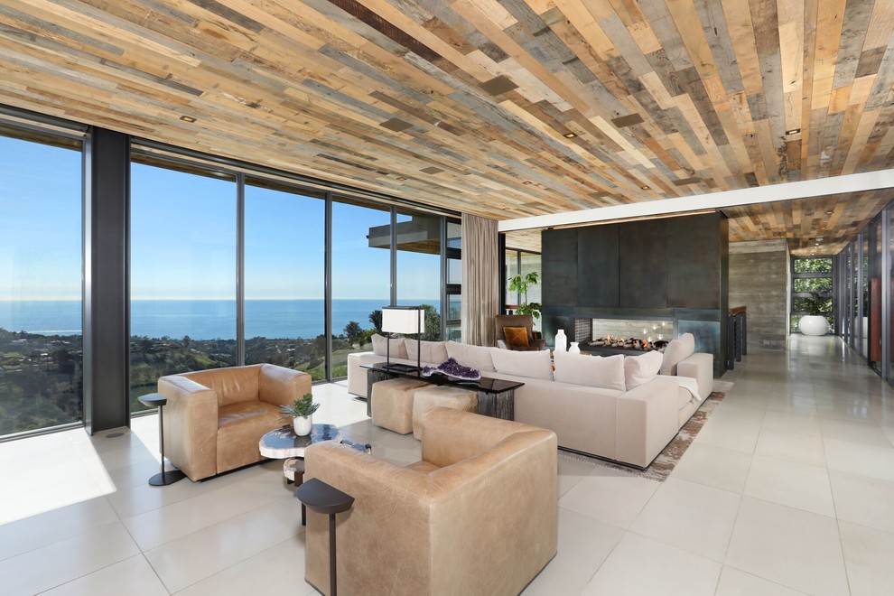Living room - large contemporary formal and open concept porcelain tile and beige floor living room idea in Orange County with a two-sided fireplace, a metal fireplace and a media wall