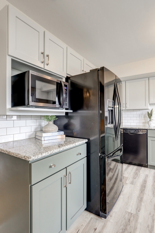 Eat-in kitchen - mid-sized transitional l-shaped eat-in kitchen idea with recessed-panel cabinets, green cabinets and a peninsula