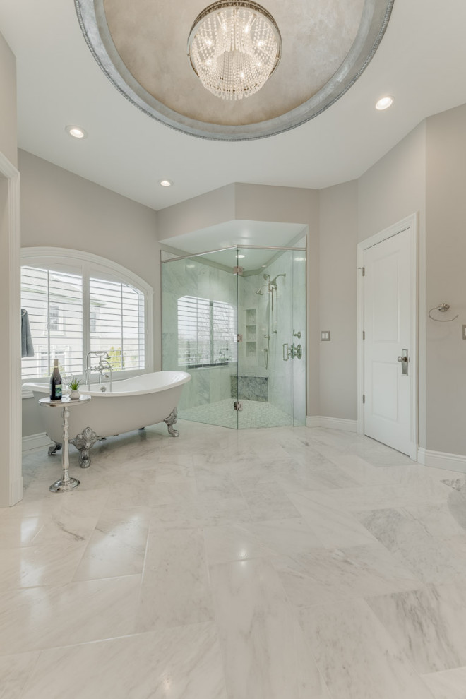 Photo of a large traditional master bathroom in DC Metro with raised-panel cabinets, white cabinets, a corner shower, gray tile, stone slab, grey walls, marble floors, a vessel sink, granite benchtops, grey floor, a hinged shower door, grey benchtops and a claw-foot tub.