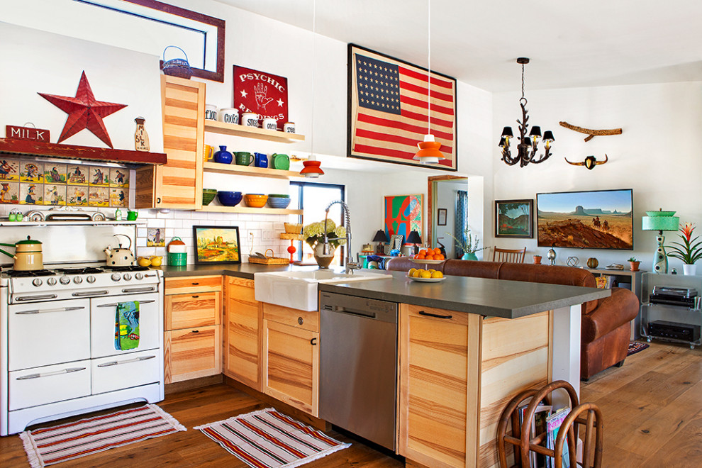 Inspiration for a large eclectic l-shaped open plan kitchen in Other with a farmhouse sink, shaker cabinets, light wood cabinets, quartzite benchtops, white splashback, subway tile splashback, white appliances, light hardwood floors, a peninsula and grey benchtop.