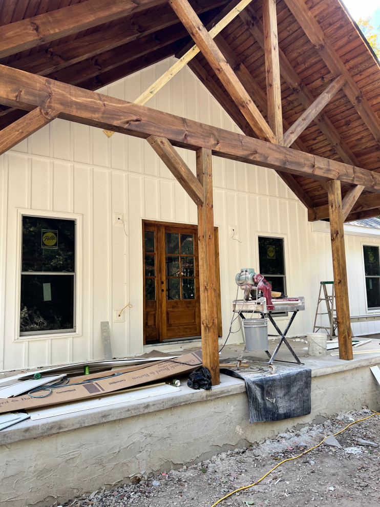 What should I hang from the wooden rafters on my front porch?