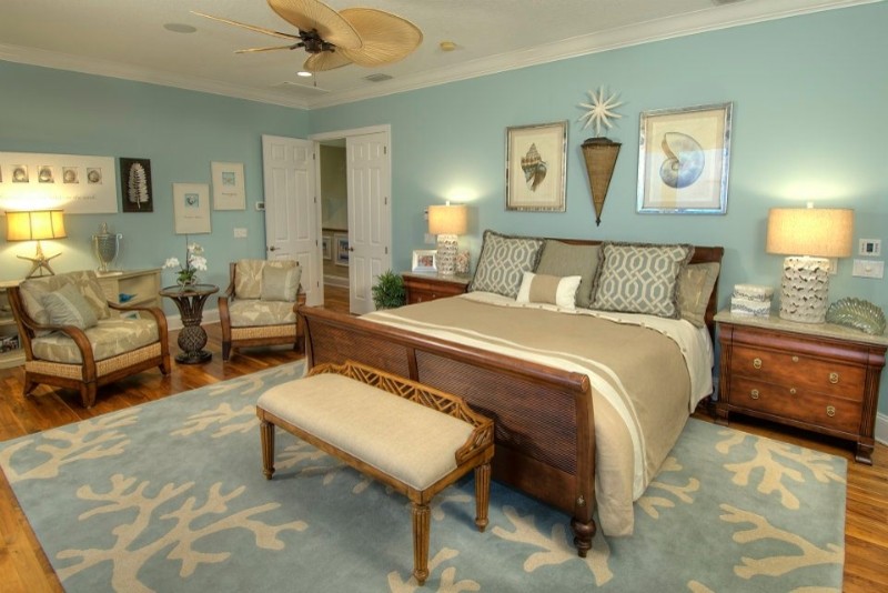 Mid-sized beach style master bedroom in Tampa with blue walls, medium hardwood floors and no fireplace.