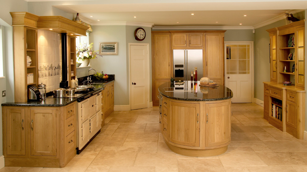 Inspiration for a medium sized traditional u-shaped kitchen/diner with a submerged sink, shaker cabinets, medium wood cabinets, granite worktops, grey splashback, stone slab splashback, coloured appliances, limestone flooring, an island, beige floors and grey worktops.