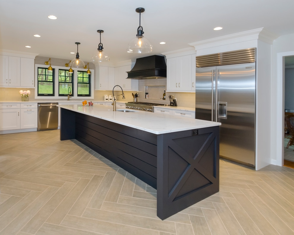 Transitional brown floor kitchen photo with an island