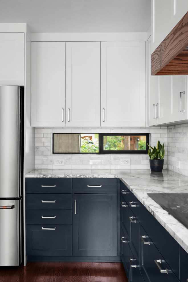 Eat-in kitchen - large transitional u-shaped medium tone wood floor and brown floor eat-in kitchen idea in Austin with a single-bowl sink, shaker cabinets, blue cabinets, quartzite countertops, gray backsplash, marble backsplash, stainless steel appliances, no island and gray countertops
