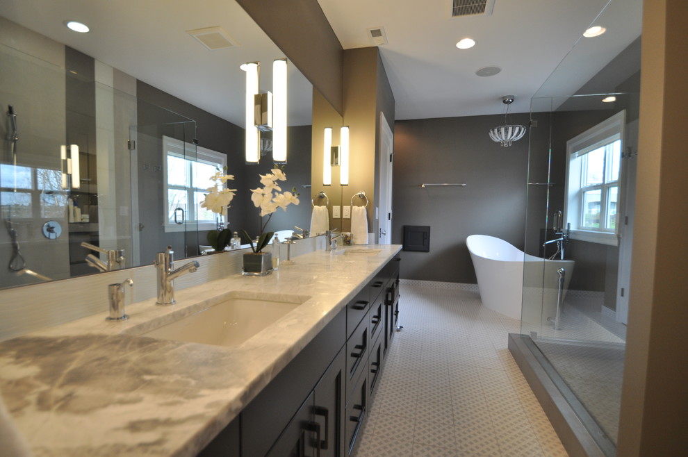 Transitional white tile freestanding bathtub photo in Seattle with gray walls