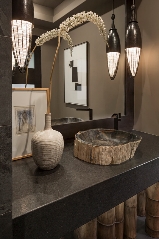 Design ideas for a mid-sized modern powder room in Phoenix with beige walls, slate floors, a vessel sink, concrete benchtops and black floor.