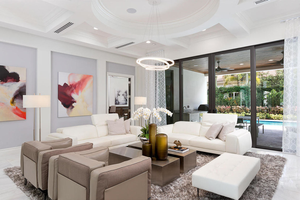 Photo of a contemporary living room in Miami with grey walls.