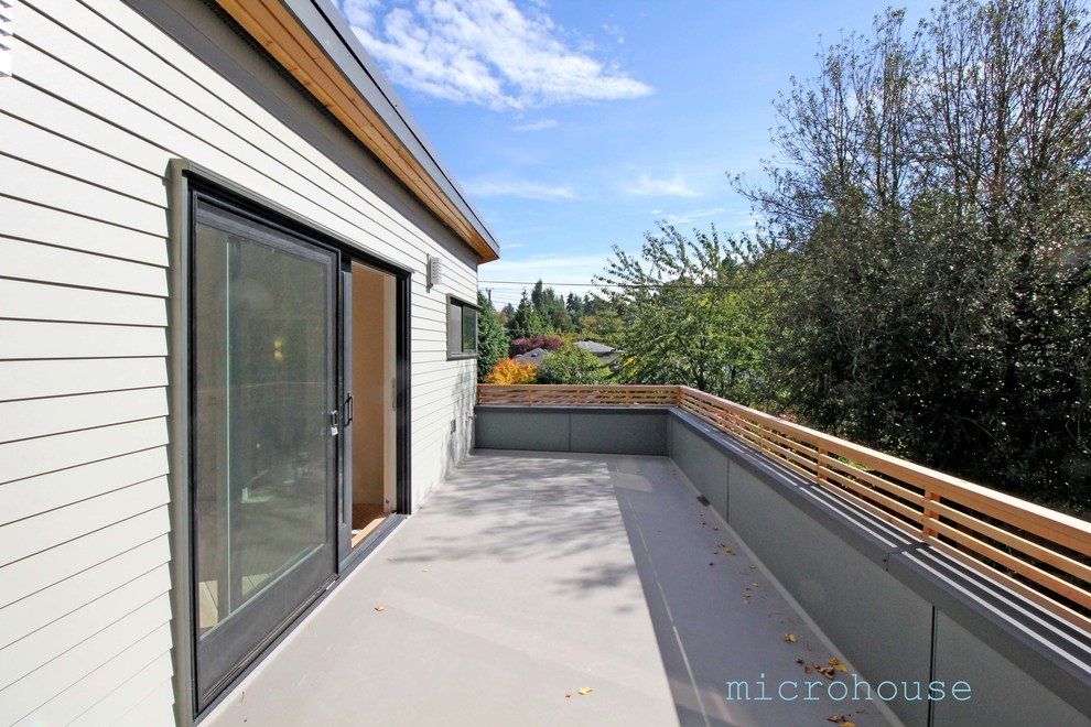 Small transitional rooftop deck photo in Seattle with no cover
