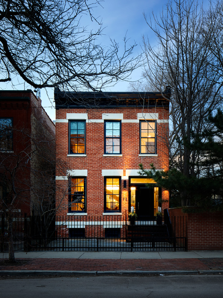 Photo of a large contemporary two-storey brick house exterior in Chicago.