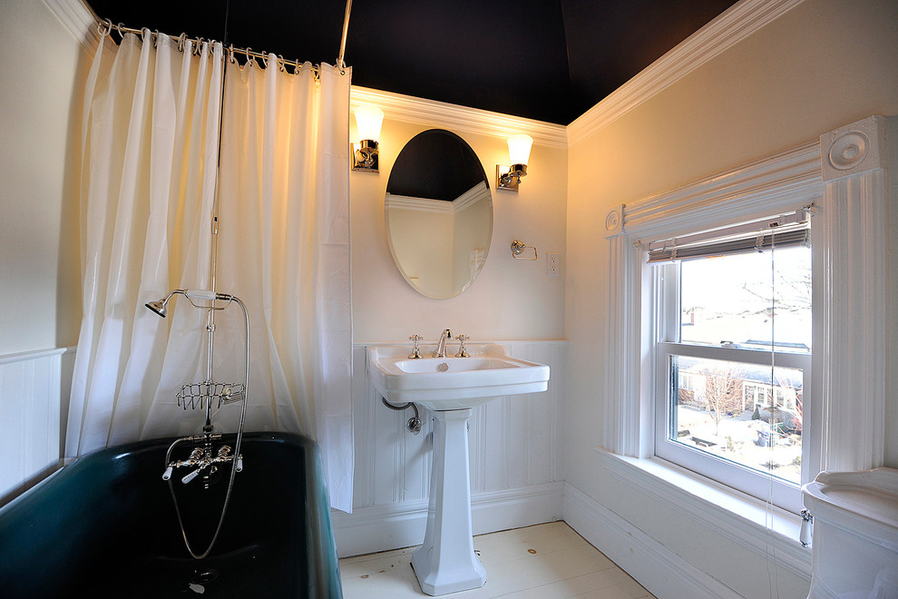 Inspiration for a small traditional 3/4 bathroom in Toronto with a claw-foot tub, a shower/bathtub combo, beige walls, porcelain floors and a pedestal sink.