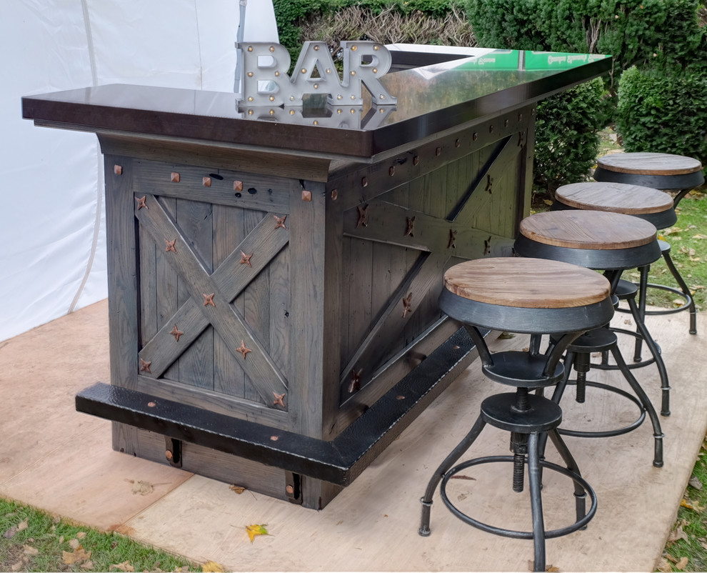 This is an example of a small country single-wall seated home bar in Other with recessed-panel cabinets, distressed cabinets and quartz benchtops.