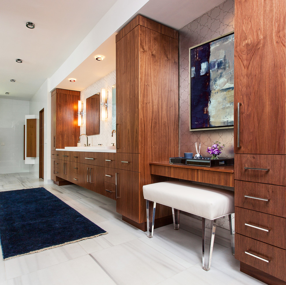 Photo of a contemporary bathroom in Miami with a drop-in sink, flat-panel cabinets and dark wood cabinets.