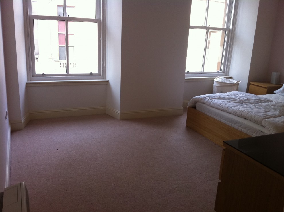 How do I furnish the extra space in my large bedroom?I have loads of