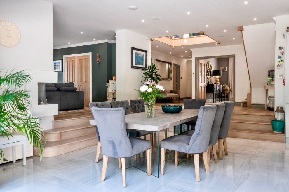 This is an example of a contemporary dining room in Surrey.