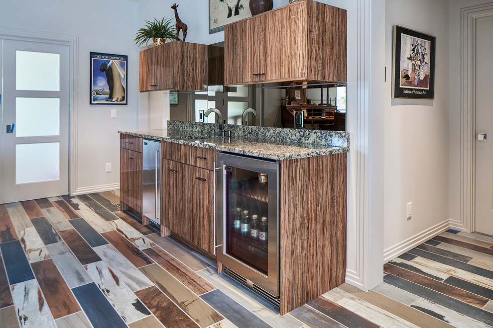 This is an example of a small contemporary single-wall seated home bar in Charleston with granite benchtops, porcelain floors, open cabinets and multi-coloured splashback.
