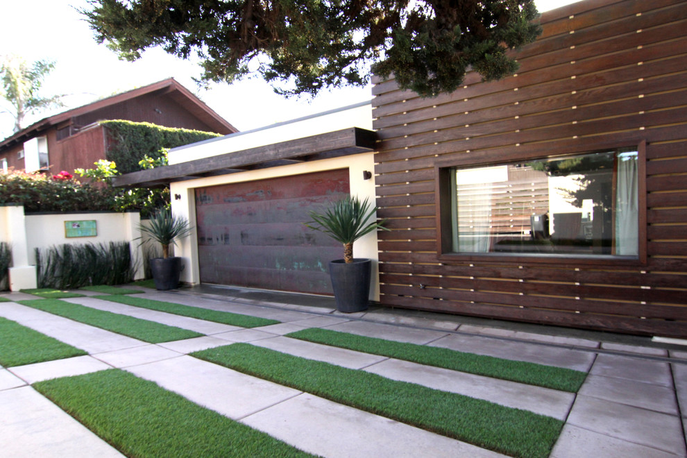 Inspiration for a contemporary attached one-car garage in San Diego.