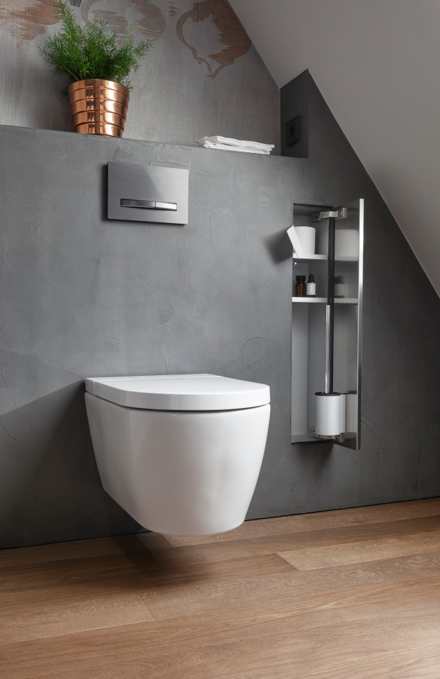 Exempel på ett mellanstort industriellt vit vitt badrum med dusch, med släta luckor, grå skåp, en kantlös dusch, en toalettstol med separat cisternkåpa, grå väggar, mörkt trägolv, ett konsol handfat, bänkskiva i akrylsten, brunt golv och med dusch som är öppen