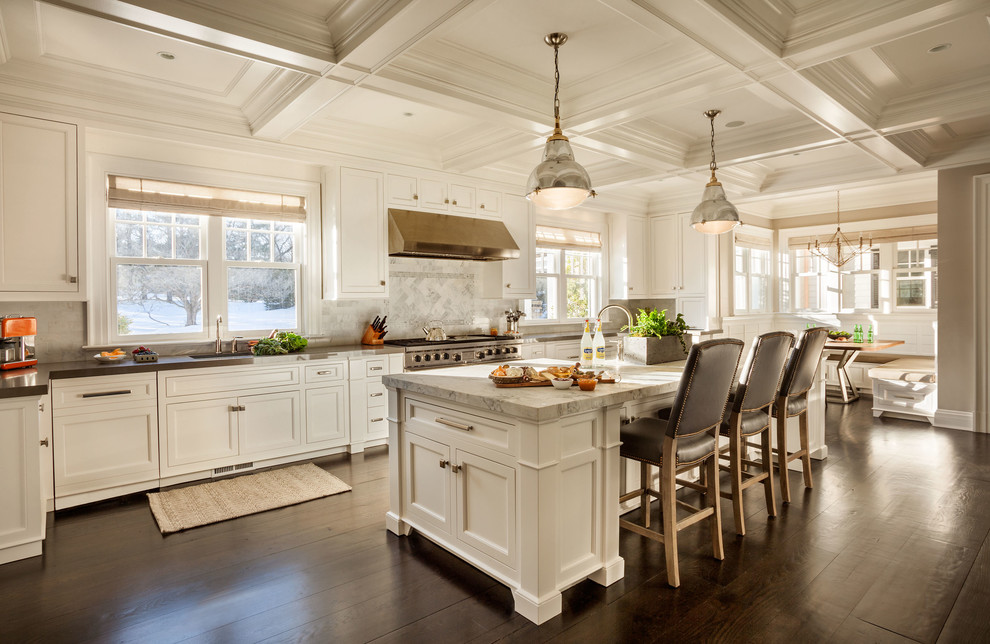 Inspiration for an expansive transitional galley separate kitchen in New York with a farmhouse sink, shaker cabinets, white cabinets, marble benchtops, white splashback, stone slab splashback, stainless steel appliances, dark hardwood floors and with island.