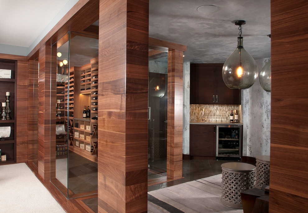 Inspiration for a large transitional wine cellar in Grand Rapids with ceramic floors, display racks and brown floor.