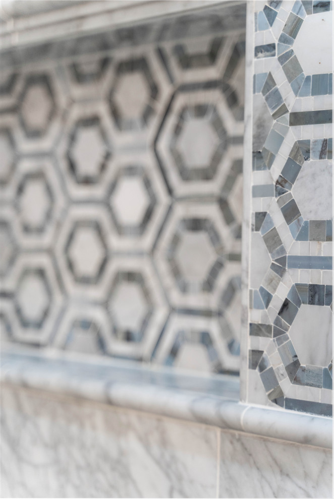 Transitional master black and white tile and marble tile porcelain tile and gray floor drop-in bathtub photo in Houston with recessed-panel cabinets, white cabinets, blue walls, an undermount sink, quartz countertops, a hinged shower door and white countertops
