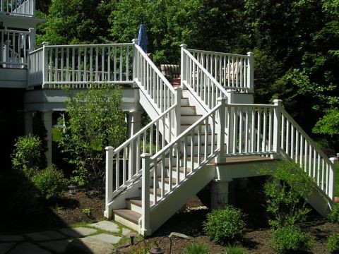 This is an example of a mid-sized traditional backyard deck in Cleveland with no cover.