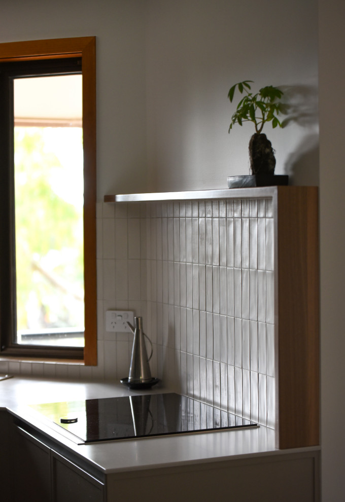 This is an example of a midcentury kitchen in Other.